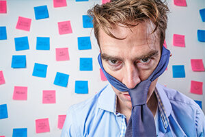 Frustrated man in front of whiteboard