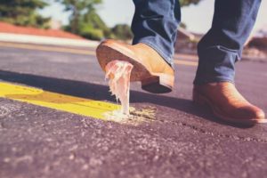 Man stepping in gum on the street