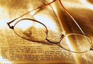 Glasses on open Bible